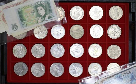 A collection of assorted British and foreign coinage in two cases.